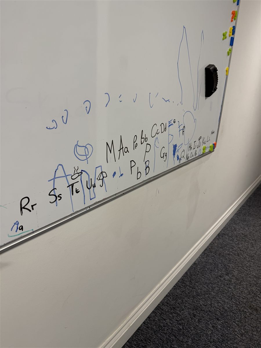 Letters written on a whiteboard