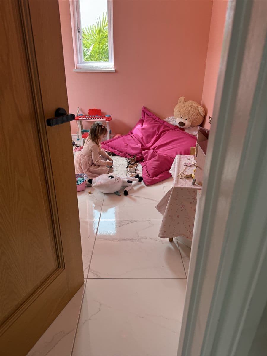 A child role-playing with toy horses